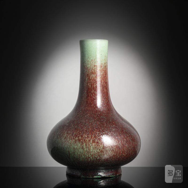 A Peachbloom-glazed porcelain bottle vase